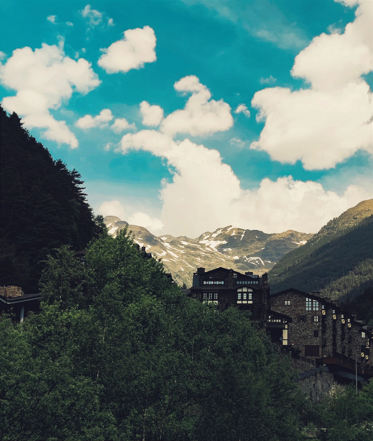 a view of a mountain range with a building in the foreground