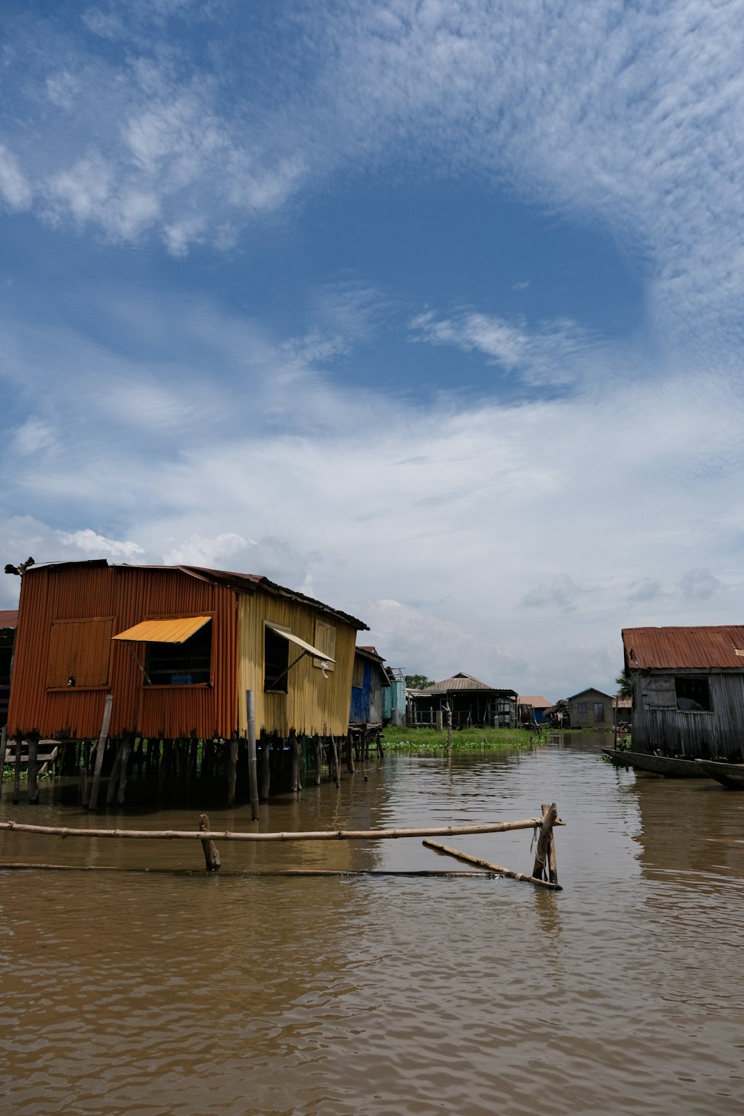 A person standing on a boat in a body of water