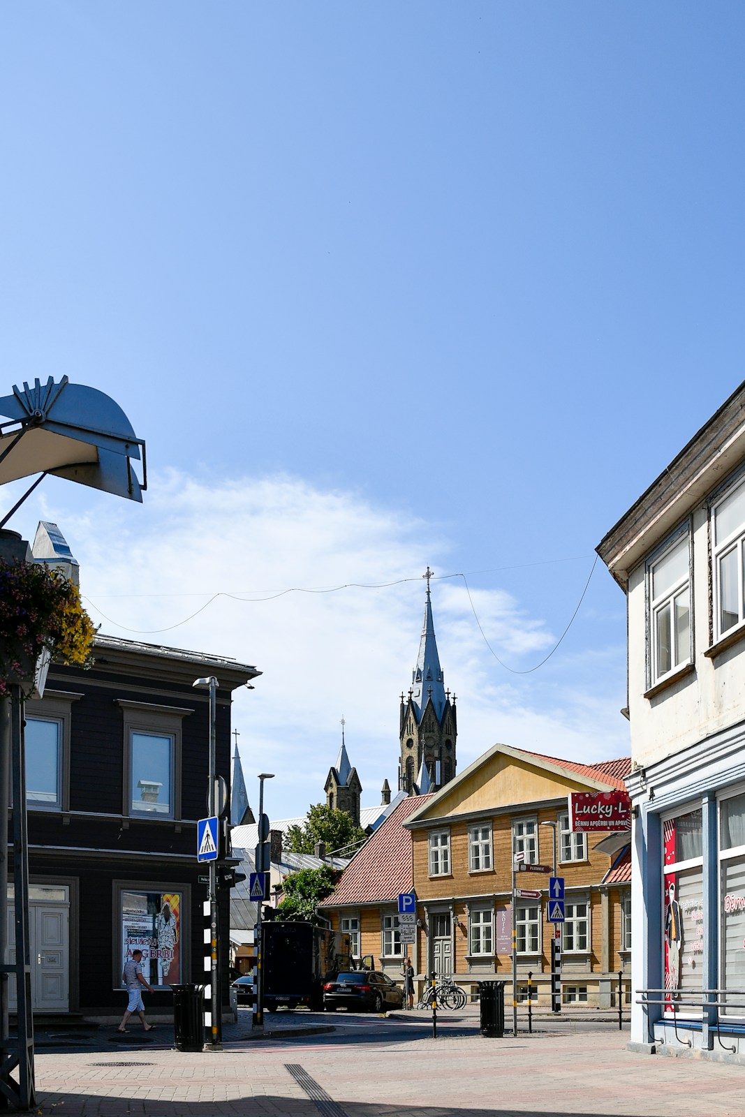 Street view with buildings and a church spire