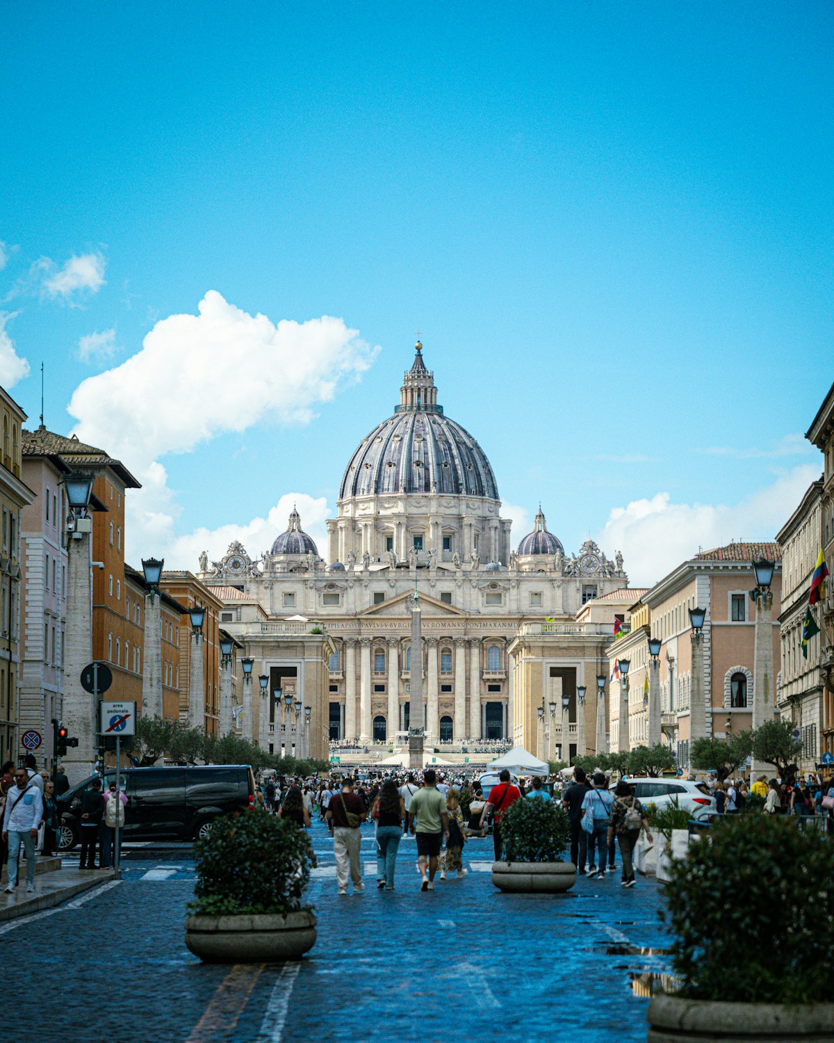 St. peter's basilica in vatican city with people walking